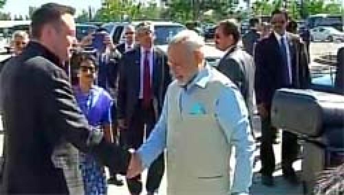 PM Modi Takes Ride in Electric Car Factory With Tesla Chief